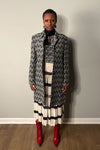 Black and white linen blend jacket by Byblos featuring fabulous repeating woven pattern.