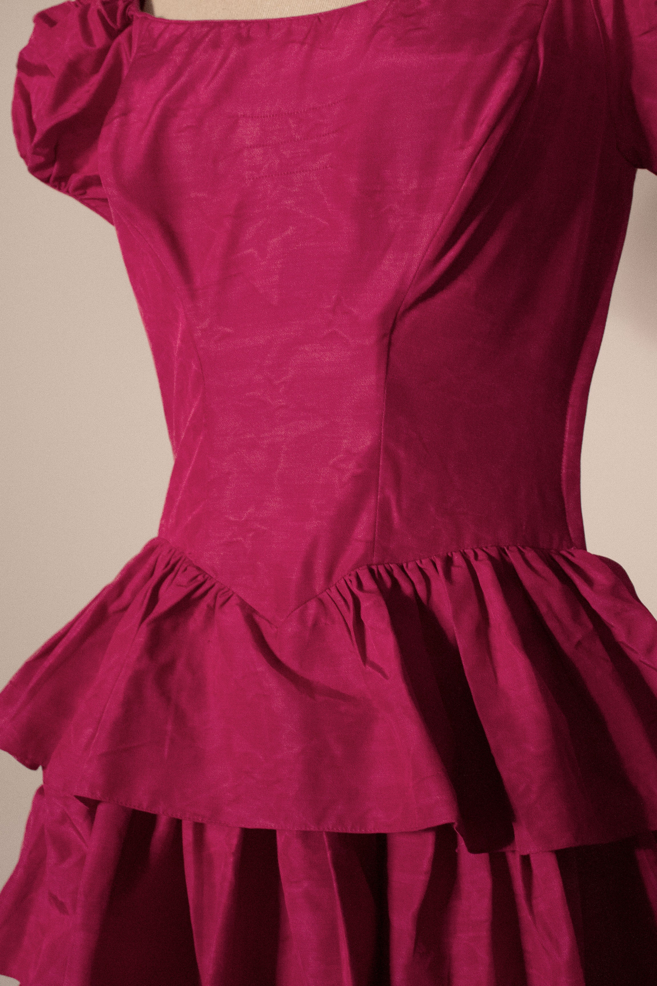 Magenta vintage puff sleeved corsetted ruffled gown